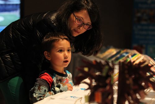 Four and a half year old Oliver Brans looks at artwork created by students in the Pembina Trails School Division  for a Unicef project on display in Buhler Hall at CMHR Saturday with his mom.   See Alex Paul story.    June 06, 2015 Ruth Bonneville / Winnipeg Free Press