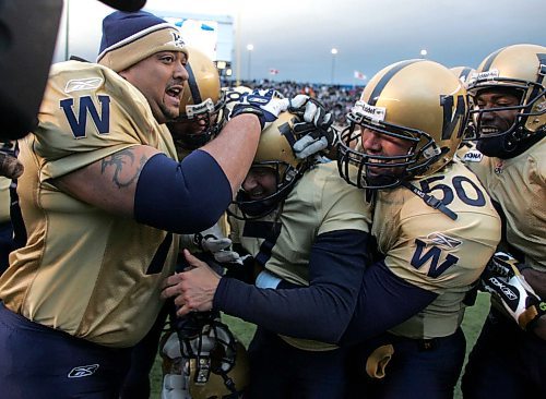 BORIS MINKEVICH / WINNIPEG FREE PRESS  071111 #7 Troy Westwood, centre is congratulated by team mates afte kicking the winning feald goal.