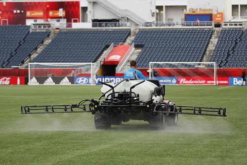 June 7, 2015 - 150607  -  A crew member prepares the pitch prior to the Team Nigeria's first practice at Winnipeg Stadium in preparation for the FIFA Women's World Cup Sunday, June 7, 2015. John Woods / Winnipeg Free Press