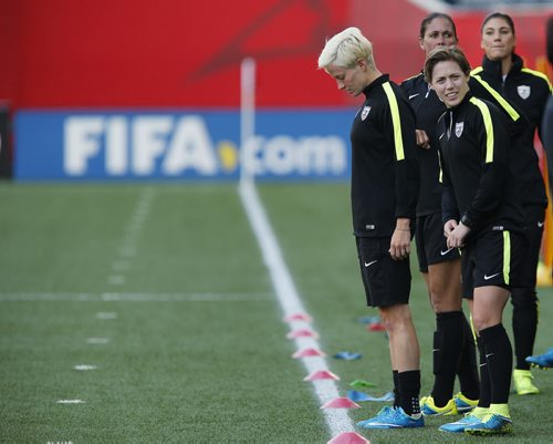 June 7, 2015 - 150607  -  Anxious Team USA players wait for the okay to step on the pitch as they practice on the pitch for the first time at Winnipeg Stadium in preparation for the FIFA Women's World Cup Sunday, June 7, 2015. John Woods / Winnipeg Free Press