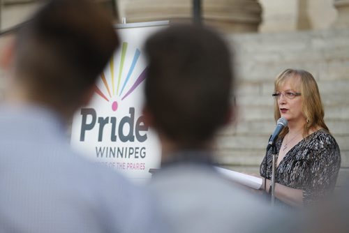 June 7, 2015 - 150607  -  Shandi Strong, advocacy coordinator for Pride Winnipeg speaks at a vigil "to remember and commemorate those who've lost theirs lives to the struggle for equal rights and social treatment" at the Legislature Sunday, June 7, 2015. John Woods / Winnipeg Free Press