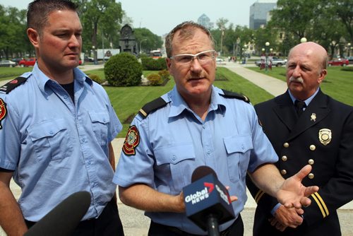 Plans to introduce first-of-its-kind legislation in Canada for post-traumatic stress disorder coverage unveiled at the Front steps of the Legislative Building. Firefighters Chad Swayze, Alex Forrest, and Ed Wiebe talk to the media after the announcement. Both of the firefighters flanking Forrest have PTSD. BORIS MINKEVICH/WINNIPEG FREE PRESS June 8, 2015