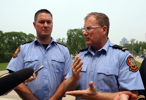 Plans to introduce first-of-its-kind legislation in Canada for post-traumatic stress disorder coverage unveiled at the Front steps of the Legislative Building. Firefighters Chad Swayze and Alex Forrest talk to the media after the announcement. BORIS MINKEVICH/WINNIPEG FREE PRESS June 8, 2015