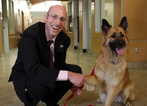 NEW CEO FOR WINNIPEG HUMANE SOCIETY - Javier Schwersensky is welcomed by Jade, a dog that is up for adoption. BORIS MINKEVICH/WINNIPEG FREE PRESS June 8, 2015
