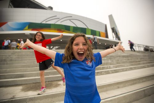 Lilly Ackerman poses for a photo with her sister, Chloe, in front of the Investors Group Field stadium prior to the Nigeria vs. Sweden FIFA World Cup game on Monday, June 8, 2015. Mikaela MacKenzie / Winnipeg Free Press