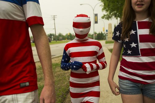 Giuliana Weber, nine, walks to the stadium in a full-body costume to see the Nigeria vs. Sweden at the FIFA women's world cup on Monday, June 8, 2015.  The Weber family is from Nebraska, and spent three hours at the border on the way to Winnipeg. Mikaela MacKenzie / Winnipeg Free Press