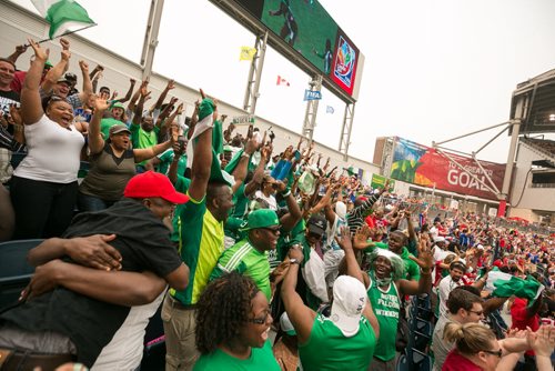 Pandemonium in the stands as a huge contingent of Nigerian fans cheer the game-tying goal by Francisca Ordega of Nigeria in the 87th minute against Sweden in the FIFA Women's World Cup match in Winnipeg. June 08, 2015 - MELISSA TAIT / WINNIPEG FREE PRESS