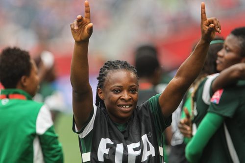 A Nigerian player acknowledges their fans after tying Sweden 3-3 in FIFA Women's World Cup soccer action in Winnipeg on Monday, June 8, 2015. 150608 - Monday, June 08, 2015 -  MIKE DEAL / WINNIPEG FREE PRESS
