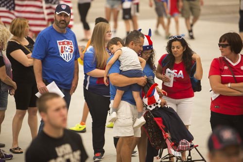 Ryan Rodriguez, four, takes a break on his dad's shoulder while waiting in  line to see the Nigeria vs. Sweden game at the Investors Group Field on Monday, June 8, 2015.  The Rodriguez' came all the way from California for the FIFA World Cup in Winnipeg. Mikaela MacKenzie / Winnipeg Free Press