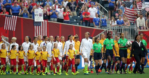 Team USA (White) and Team Australia are led onto the Field and Investor's Field Monday evening in FIFA World Cup Action. June 8, 2015 - (Phil Hossack / Winnipeg Free Press)
