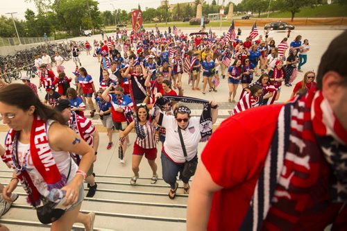 Members of the soccer fan group the American Outlaws march up to the stadium to see the FIFA World Cup United States vs. Australia game at the Investors Group Field on Monday, June 8, 2015. Mikaela MacKenzie / Winnipeg Free Press