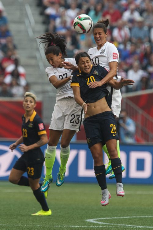 Australia's Samantha Kerr (20) heads a ball while USA's Christen Press (23) and Carli Lloyd (10) try to disrupt during the FIFA Women's World Cup soccer action in Winnipeg on Monday, June 8, 2015. 150608 - Monday, June 08, 2015 -  MIKE DEAL / WINNIPEG FREE PRESS