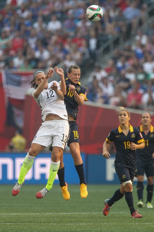 USA's Lauren Holiday (12) and Australia's Emily Van Egmond (10) try to head the ball during FIFA Women's World Cup soccer action in Winnipeg on Monday, June 8, 2015. 150608 - Monday, June 08, 2015 -  MIKE DEAL / WINNIPEG FREE PRESS