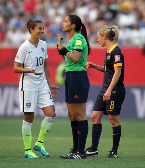 Team USA's # 10Carli Lloyd and referree Claudia Umpierrez argue the finer points of the game Monday at Investor's Field in FIFA action against Australia. June 8, 2015 - (Phil Hossack / Winnipeg Free Press)