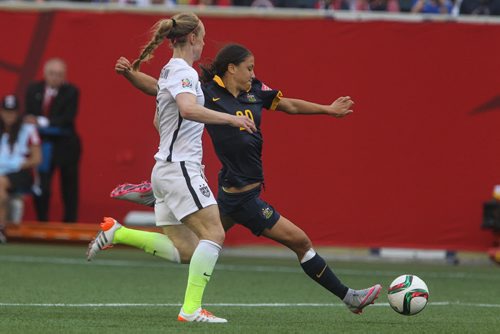 Australia's Samantha Kerr (20) kicks the ball past USA's Becky Sauerbrunn (4) during the second half of FIFA Women's World Cup soccer action in Winnipeg on Monday, June 8, 2015. 150608 - Monday, June 08, 2015 -  MIKE DEAL / WINNIPEG FREE PRESS