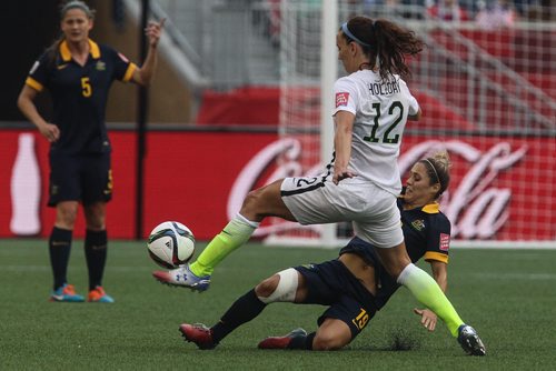 Australia's Katrina Gorry (19) tries to stop USA's Lauren Holiday (12) during the second half of FIFA Women's World Cup soccer action in Winnipeg on Monday, June 8, 2015. 150608 - Monday, June 08, 2015 -  MIKE DEAL / WINNIPEG FREE PRESS