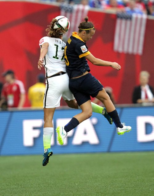 Australia's #9Caitin Foord (right) and USA's #17 collide mid-air heading the ball Monday evening at Investor's Field.  June 8, 2015 - (Phil Hossack / Winnipeg Free Press)