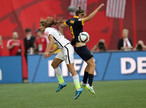 Australia's #9Caitin Foord (right) and USA's #17 collide mid-air heading the ball Monday evening at Investor's Field.  June 8, 2015 - (Phil Hossack / Winnipeg Free Press)