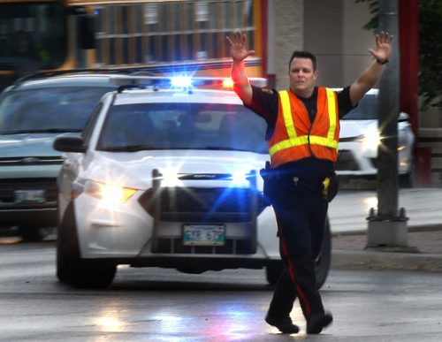 Winnipeg Police were out directing traffic on Portage Ave. at St. James Ave. Tuesday morning after power outage in parts of St. James.   Wayne Glowacki / Winnipeg Free Press June 9 2015