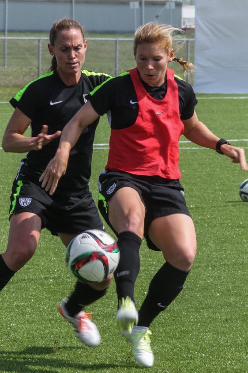 Lori Chalupny (red bib) and Christie Rampone (behind) from team USA practice at the Waverly Soccer Complex Tuesday morning. 150609 - Tuesday, June 09, 2015 -  MIKE DEAL / WINNIPEG FREE PRESS
