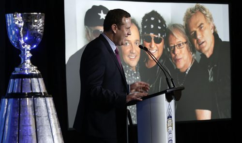 Jason Smith, pres. of the 103rd Grey Cup Festival along with the Grey Cup at the University of Winnipegs Health & RecPlex Tuesdayfor the announcement of the festival events Nov.25-29 including the band Loverboy part of the concert series in the MTS centre Nov.28. Scott Billeck story. Wayne Glowacki / Winnipeg Free Press June 9 2015