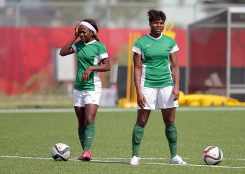 Nigeria's Francisca Ordega (left) and Desire Oparanozie on the practice field Tuesday afternoon. Both scored against Sweden Monday afternoon. See Tim Campbell's story.  June 9, 2015 - (Phil Hossack / Winnipeg Free Press)