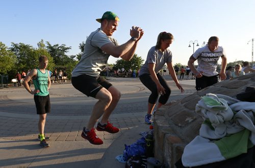 49.8 Training Basket.  Thomas Hall with hat and  Rick Duha at left take part in jumping exercise with group.  They started the November Project in Winnipeg. The NP is a group of people who get together on a weekly basis and workout in The Forks area. Wayne Glowacki / Winnipeg Free Press June 10 2015