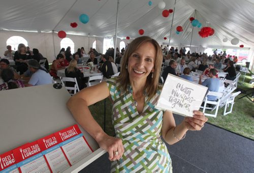 Stephanie Staples, professional motivational speaker, MC's the Red Table Luncheon, a United Way hosted event under a huge tent on King Street  with 300 guests from across the city taking part in a round table discussion on how to make Wpg a better city Wednesday. Standup photo    June 10, 2015 Ruth Bonneville / Winnipeg Free Press