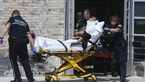 Winnipeg Police and Paramedics were on the scene of the Neechi Commons building on Main Street at Euclid Ave. Wednesday afternoon where a person was taken out on a stretcher and taken to the hospital. Police tape was put up  at the entrance to the building. Wayne Glowacki / Winnipeg Free Press June 10 2015