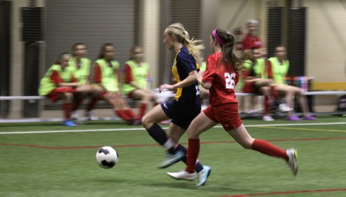 Australia's #7 Nickoletta Flannery (in blue) is pursued down the field by Bonvital's #26 Abby Laurin Wednesday.  See Jeff Hamilton's story. June 10, 2015 - (Phil Hossack / Winnipeg Free Press)