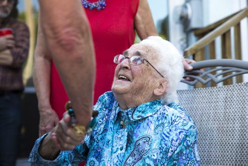91-year-old Gunvor Larsson says hello to other guests at a fish fry for soccer fans at Sonja Lundstrom's house on Wednesday, June 10, 2015.  Larsson came over to Canada from Sweden in 1958, and is still going strong - she baked all of the bread for the meal. Mikaela MacKenzie / Winnipeg Free Press
