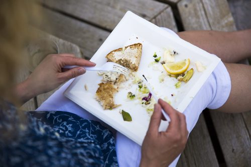 Guests eat and mingle at a fish fry for soccer fans at Sonja Lundstrom's house on Wednesday, June 10, 2015.  Fried pickerel, maple beans, coleslaw, and homemade bread all made for a typically Canadian meal to serve to the Swedish fans. Mikaela MacKenzie / Winnipeg Free Press
