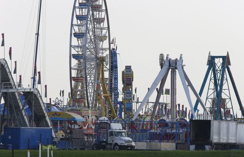 The site at Red River Exhibition Park Thursday morning has taken shape for the excitement that includes rides, entertainment, music and the Canadian debut of the Gravity Jump at The Ex that begins June 12-21.   Wayne Glowacki / Winnipeg Free Press June 11 2015