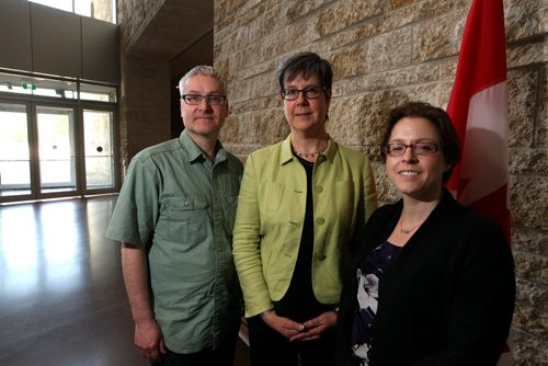 LOCAL -Left to right - Renald Remillard, Lorna Turnbull, the dean of the U of M law school, and Aileen Clark pose for a photo at the CMHR, where they are having their meetings. They are part of a group meeting today at the CMHR to discuss ensuring people are able to get representation in Manitoba in both English and French. It's a growing problem in the province with more francophone immigrants. Kirbyson story. BORIS MINKEVICH/WINNIPEG FREE PRESS June 11, 2015