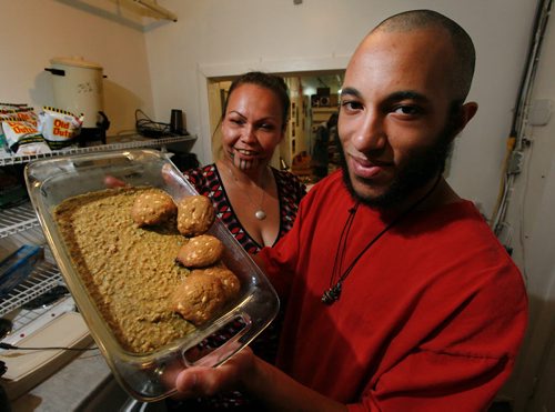 Tyrell Benton (edibles baker), Lee-Anne Kent (co-founder, Vapes Off Main) (left) pose at the Marijuana Resource Center Thursday with some of the baked "products" now legal under new legislation. See story by Jessica Botelho-Urbanski. June 11, 2015 - (Phil Hossack / Winnipeg Free Press)