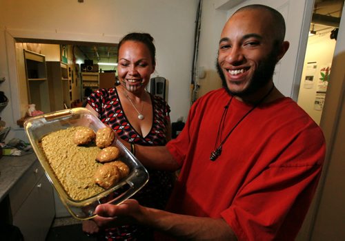 Tyrell Benton (edibles baker), Lee-Anne Kent (co-founder, Vapes Off Main) (left) pose at the Marijuana Resource Center Thursday with some of the baked "products" now legal under new legislation. See story by Jessica Botelho-Urbanski. June 11, 2015 - (Phil Hossack / Winnipeg Free Press)