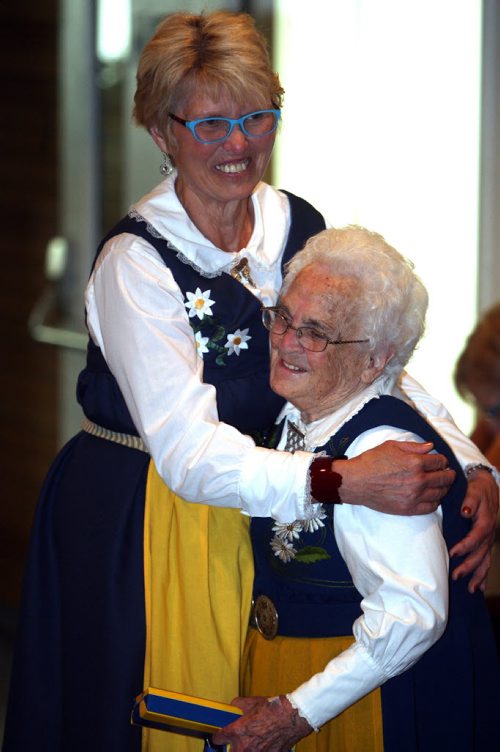 A bunch of Swedish people are at the Scandanavian Cultural Centre at 764 Erin St. Kirbyson story. (L-R) The Swedish Cultural Association of Manitoba past president Sonja Lundström gives Gunvor Larsson a hug. BORIS MINKEVICH/WINNIPEG FREE PRESS June 12, 2015