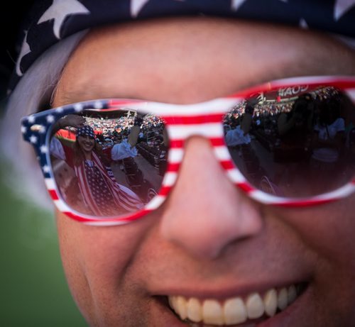 Megan Snyder, dressed as Betsy Ross, reflected in the sunglasses of Bryan Shirah, dressed as George Washington at the U.S vs Sweden FIFA Women's World Cup match in Winnipeg Friday. June 12, 2015 - MELISSA TAIT / WINNIPEG FREE PRESS