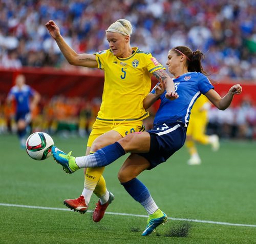 Sweden defender Nilla Fischer fends off U.S. forward Alex Morgan (recently returned from injury) late in the second half of the 0-0 tie. FIFA Women's World Cup Friday evening at Investors Group Field. June 12, 2015 - MELISSA TAIT / WINNIPEG FREE PRESS