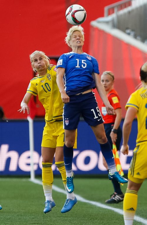 U.S. midfielder Megan Rapinoe heads the ball ahead of Sweden forward Sofia Jakobsson in the second half of their 0-0 tie. FIFA Women's World Cup on Friday evening at Investors Group Field June 12, 2015 - MELISSA TAIT / WINNIPEG FREE PRESS
