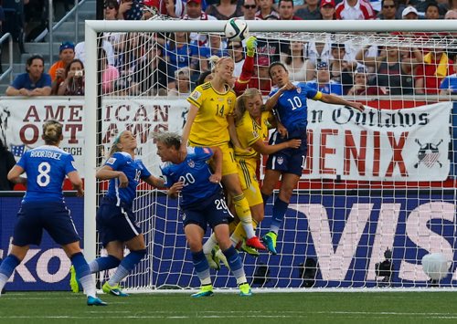 U.S. goalkeeper Hope Solo's fist just reaches a Swedish cross in the second half of a 0-0 tie. FIFA Women's World Cup on Friday evening at Investors Group Field June 12, 2015 - MELISSA TAIT / WINNIPEG FREE PRESS