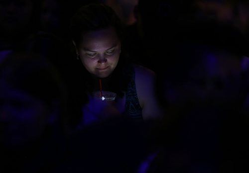 A girl uses her phone before Ed Sheeran performs at MTS Centre, Friday, June 12, 2015. (TREVOR HAGAN/WINNIPEG FREE PRESS)