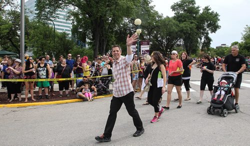 Winnipeg Mayor Brian Bowman walks the parade route along with hundreds who showed up to take part in the 28th Anniversary of the Winnipeg Pride Parade Sunday afternoon. 150614 - Sunday, June 14, 2015 -  MIKE DEAL / WINNIPEG FREE PRESS