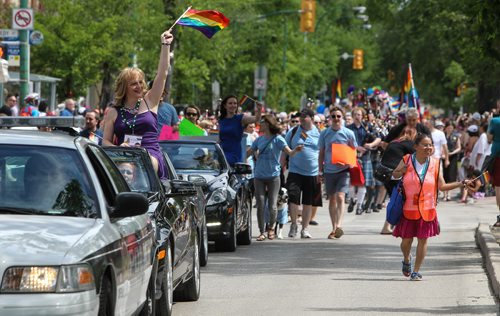Shandi Strong (left) leads the parade as the Grand Marshal of the 28th Anniversary of the Winnipeg Pride Parade Sunday afternoon. 150614 - Sunday, June 14, 2015 -  MIKE DEAL / WINNIPEG FREE PRESS