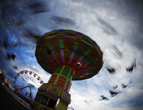 June 14, 2015 - 150614  -  Winnipeggers braved the rain to attend the Red River Ex Sunday, June 14, 2015. John Woods / Winnipeg Free Press