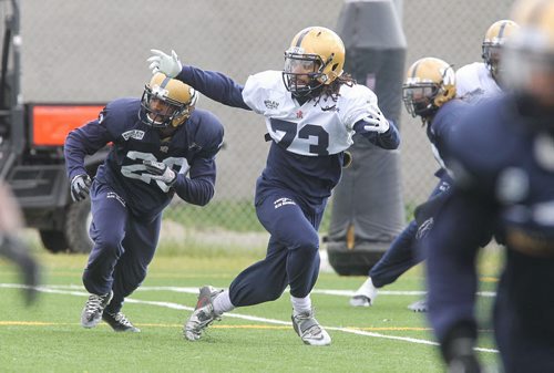 Justin Veltung (73) indicates his readiness to receive the ball during Winnipeg Blue Bombers practice Monday morning.  150615 June 15, 2015 MIKE DEAL / WINNIPEG FREE PRESS