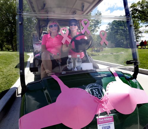 Kristel Coldwell at right, and Sharon Riches on the course during the Pink Ribbon Ladies Golf Classic for Hope at the Niakwa Country Club Monday.   About 160 women golfed in the annual fundraising event for CancerCare Manitobas Breast Cancer Centre of Hope. Wayne Glowacki / Winnipeg Free Press June 15 2015