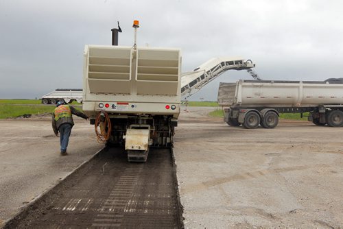 Ste. Agathe, MB.  Crews grind out the road there for reconstruction. Dan Lett feature on hwy 75  construction - comparing canada/US.  BORIS MINKEVICH/WINNIPEG FREE PRESS June 25, 2014