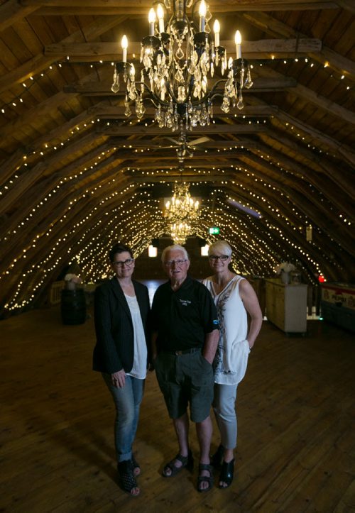 Owners and operators of The Wedding Barn near Steinbach, Manitoba inside The Loft, the top level of the renovated barn. Edna Wiebe (left), her father Peter Wiebe and sister Sandra Toews. See story by Bill Redekop June 11, 2015 - MELISSA TAIT / WINNIPEG FREE PRESS