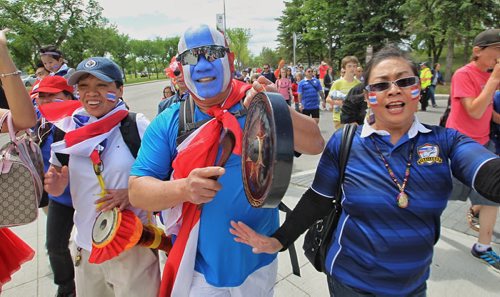 Captain Thailand and other Thailand fans get into the spirit as they approach the entrance to the stadium for the FIFA Women's World Cup match between Germany and Thailand Monday afternoon in Winnipeg.  150615 June 15, 2015 MIKE DEAL / WINNIPEG FREE PRESS